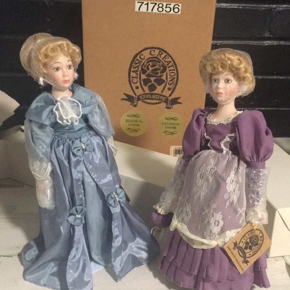 Classic Creations Exclusive hand-crafted Bianca & Catherine porcelain dolls.